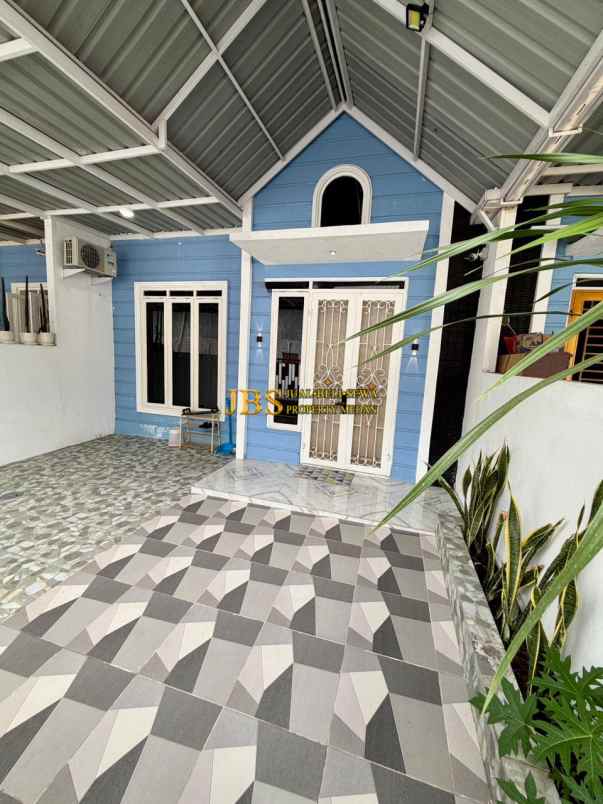 dijual rumah komplek griya manhattan