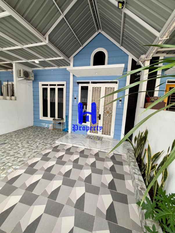 dijual rumah komplek griya manhattan