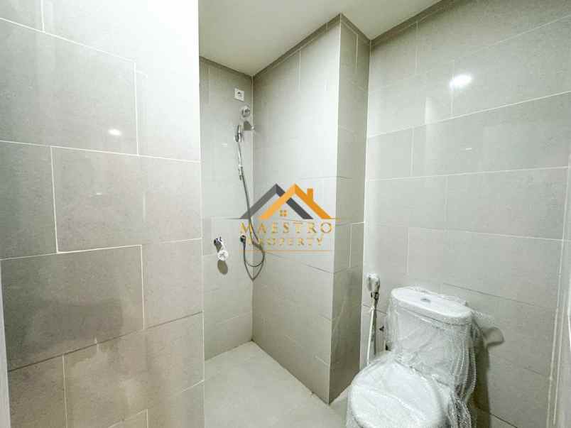dijual apartemen podomoro city deli tower