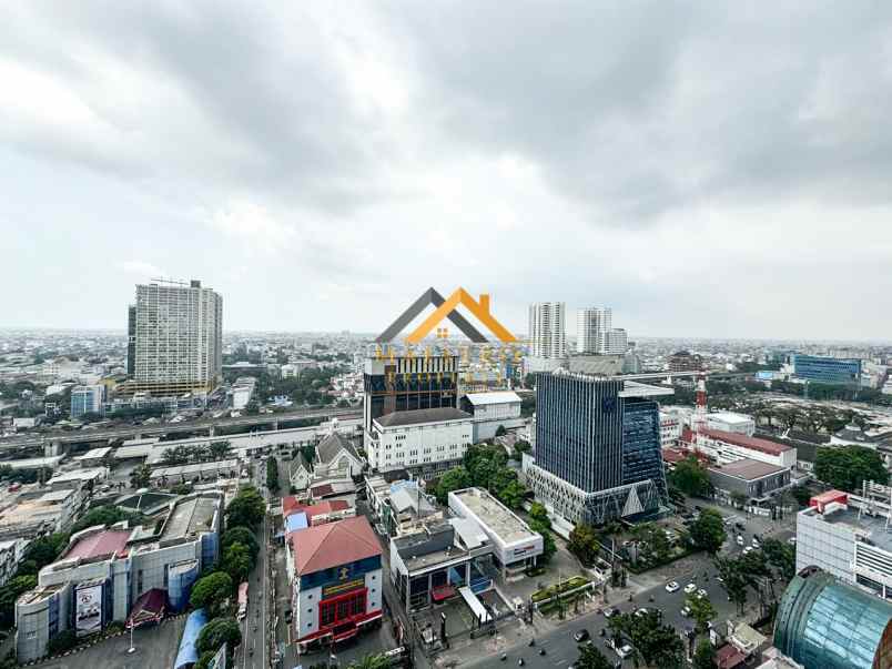 dijual apartemen podomoro city deli tower