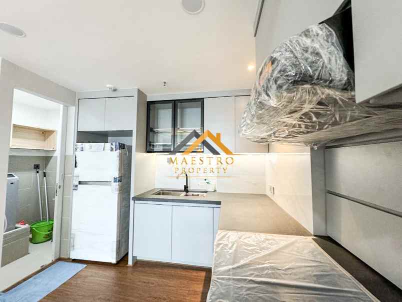 dijual apartemen podomoro city deli tower