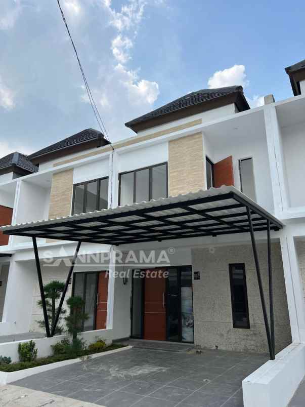 dijual rumah jln raya harjamukti