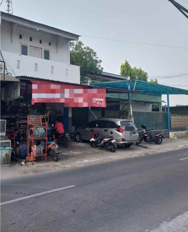 dijual rumah jalan raya karang tengah
