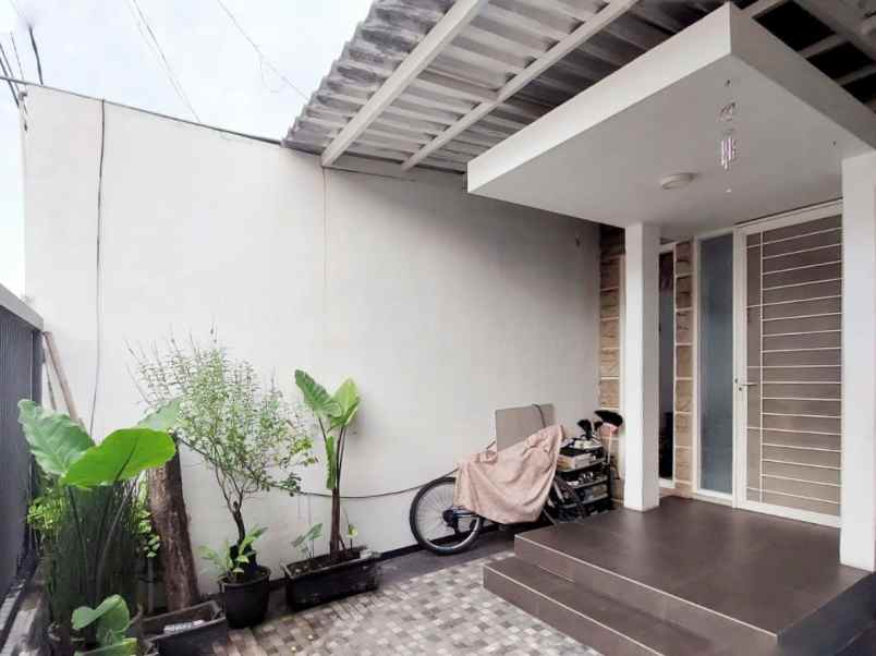 rumah pantai mentari minimalis carport row 3 mobil