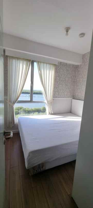 apartemen east coast 2 br furnish di pakuwon