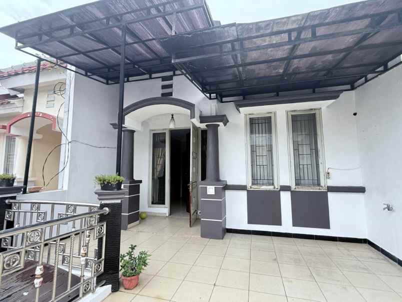 rumah cluster taman puspa kota harapan indah bekasi