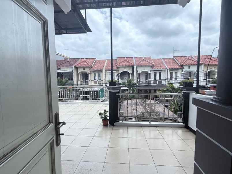 rumah cluster taman puspa kota harapan indah bekasi
