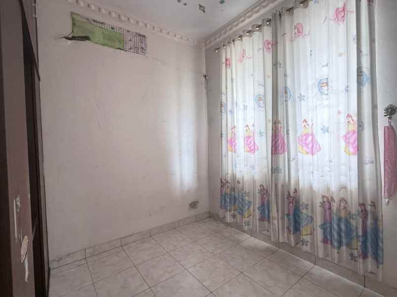 rumah cluster taman puspa kota harapan indah bekasi