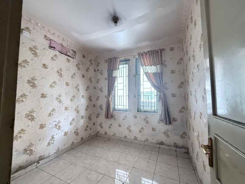 rumah cluster taman puspa kota harapan indah bekasi