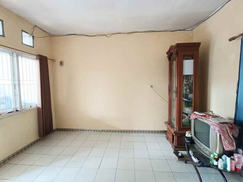 over kredit rumah taman mutiara indah 2