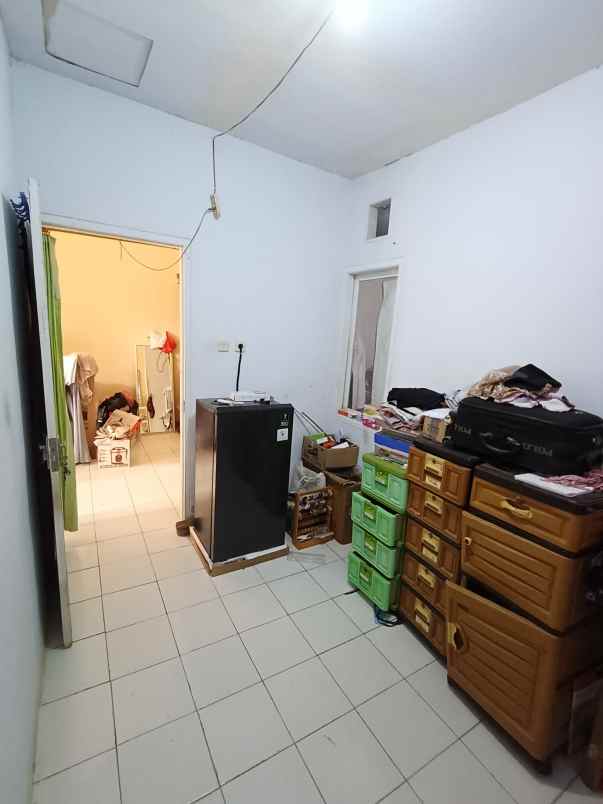 over kredit rumah taman mutiara indah 2