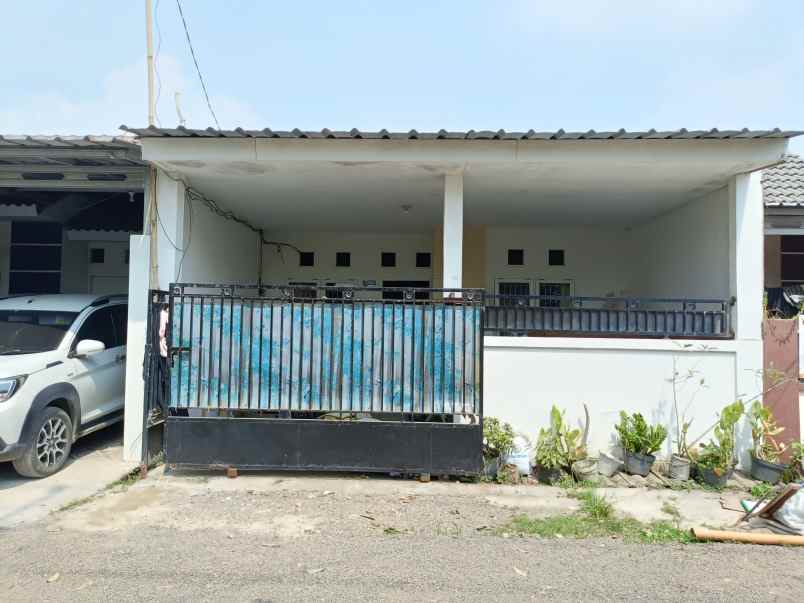 over kredit rumah taman mutiara indah 2