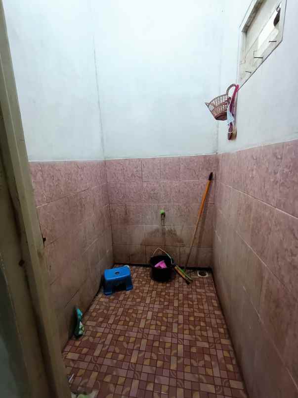 over kredit rumah taman mutiara indah 2