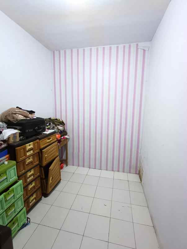 over kredit rumah taman mutiara indah 2