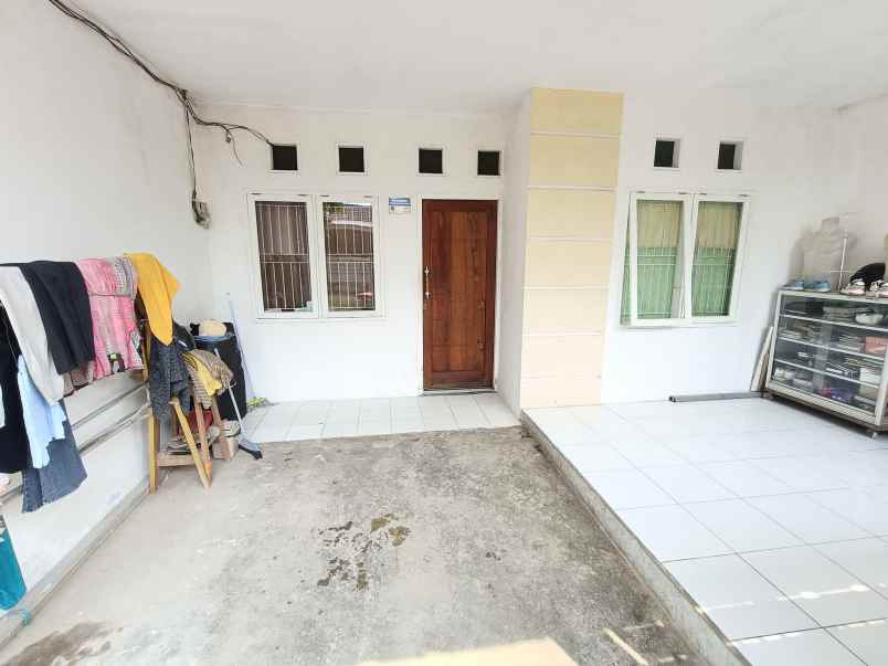 over kredit rumah taman mutiara indah 2