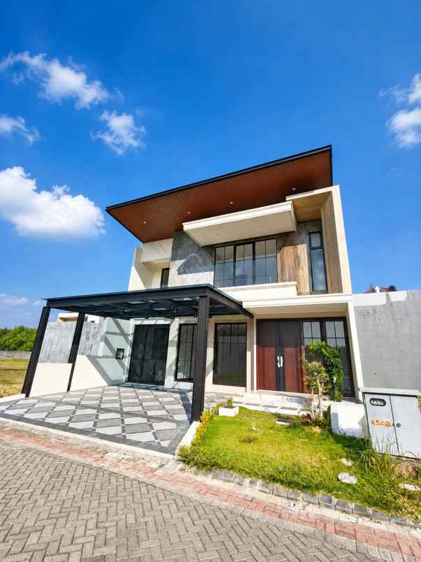 rumah besar minimalis pakuwon city grand island