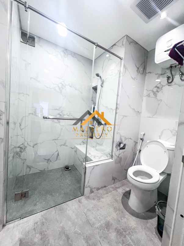 dijual apartemen podomoro city deli tower