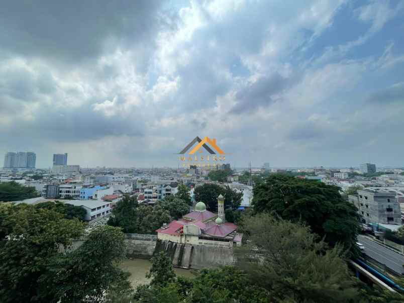 dijual apartemen podomoro city deli tower