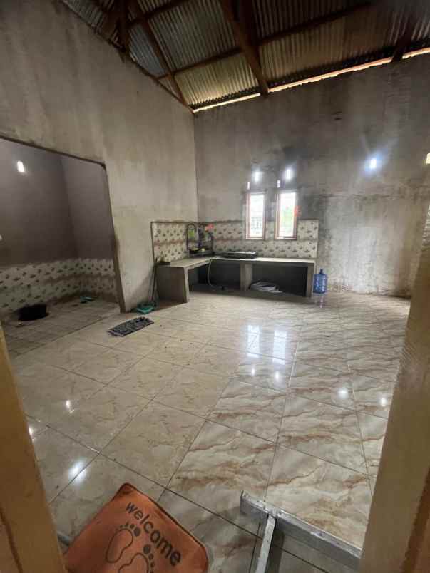 dijual cepat rumah 2 unit di jalan poros marawola