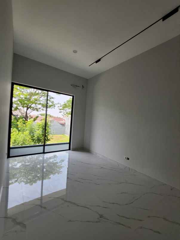 rumah baru woodland citraland surabaya barat