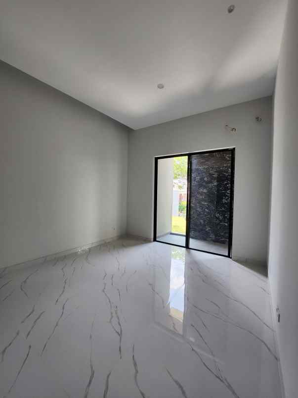 rumah baru woodland citraland surabaya barat