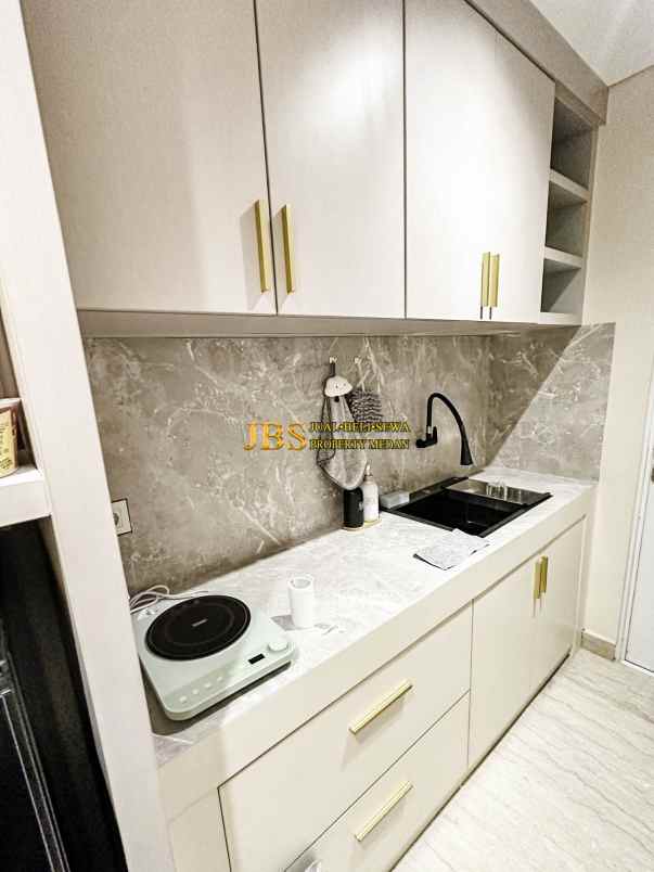 dijual apartemen podomoro city deli tower