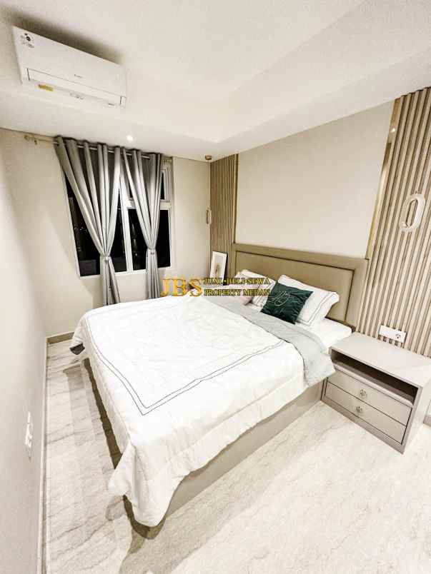 dijual apartemen podomoro city deli tower