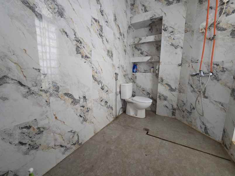 dijual rumah dharmahusada indah