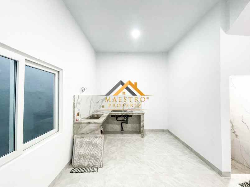 dijual rumah komplek mados royal suite