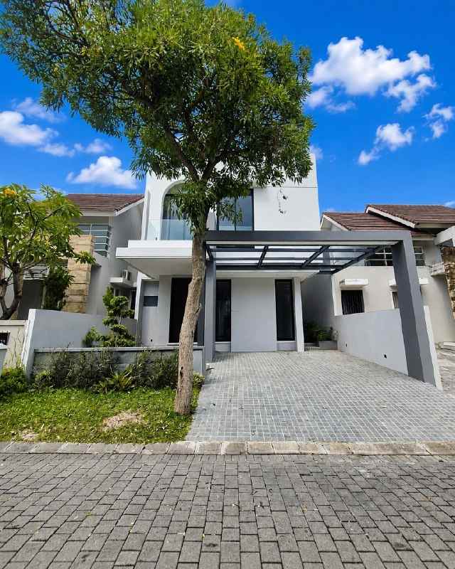 rumah woodland citraland new minimalis carport