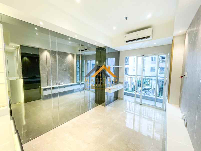 dijual apartemen podomoro city deli tower