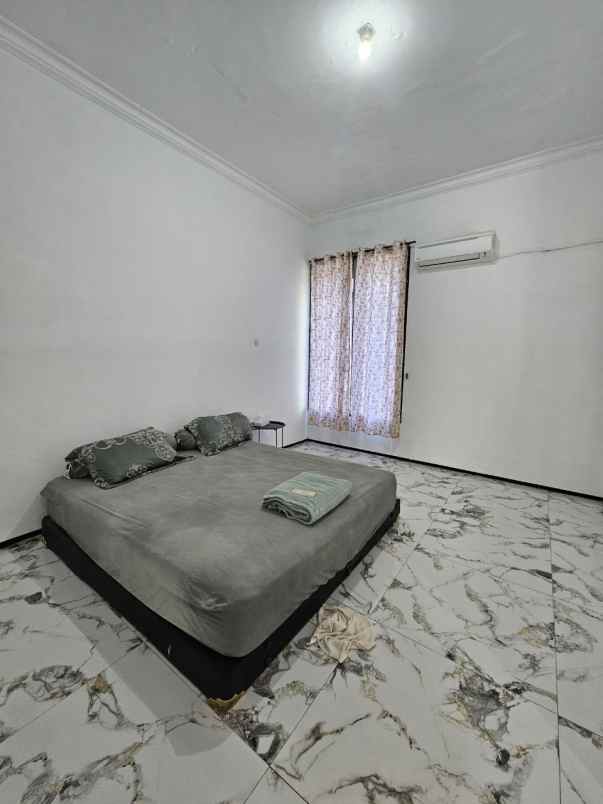 rumah dharmahusada indah strategis siap huni