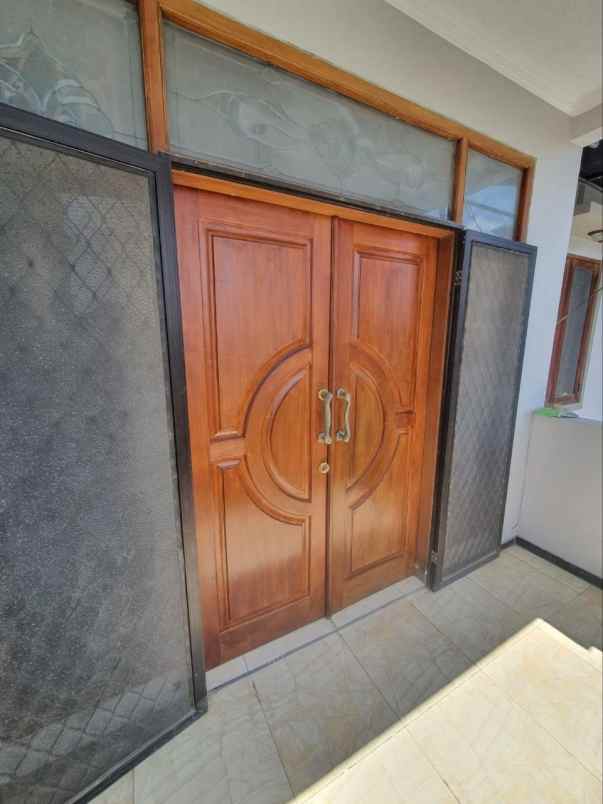 rumah di dharmahusada indah mas