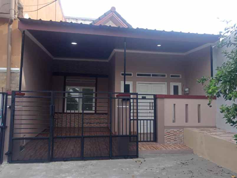 dijual rumah taman harapan baru