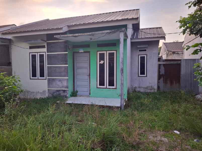 over kredit rumah jl suka karya kualu panam