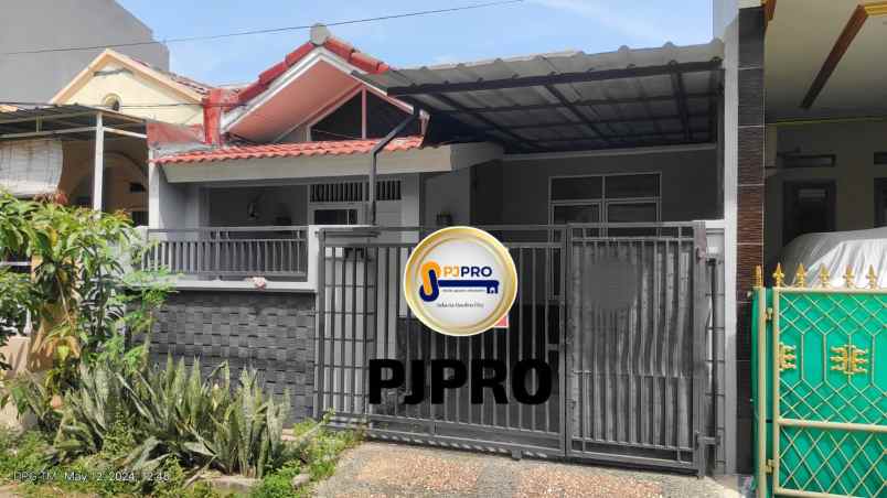 dijual rumah taman harapan baru