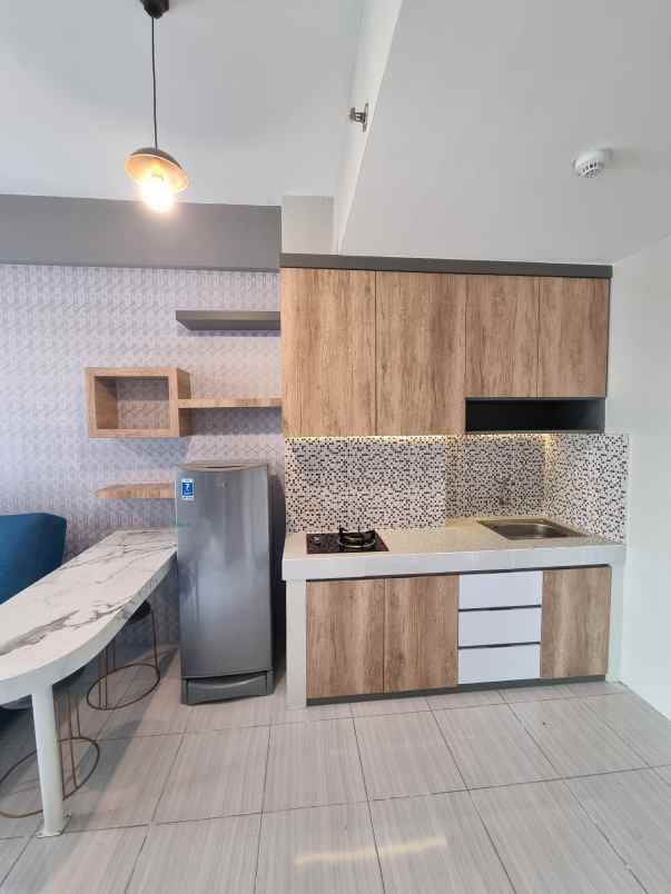 apartemen puncak dharmahusada tipe 2br lantai