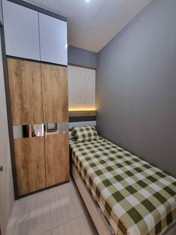 apartemen puncak dharmahusada tipe 2br lantai