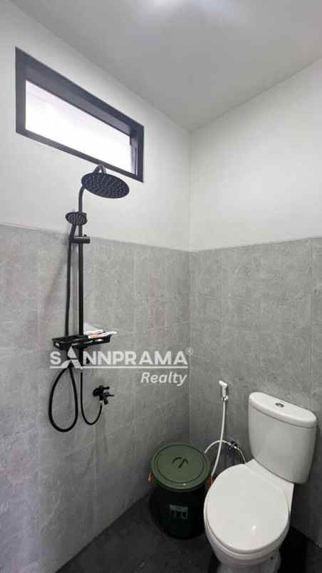 dijual rumah jln raya tapos depok