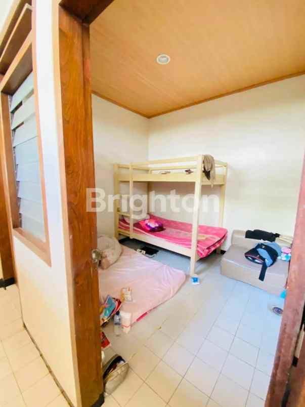 dijual rumah dharmahusada indah