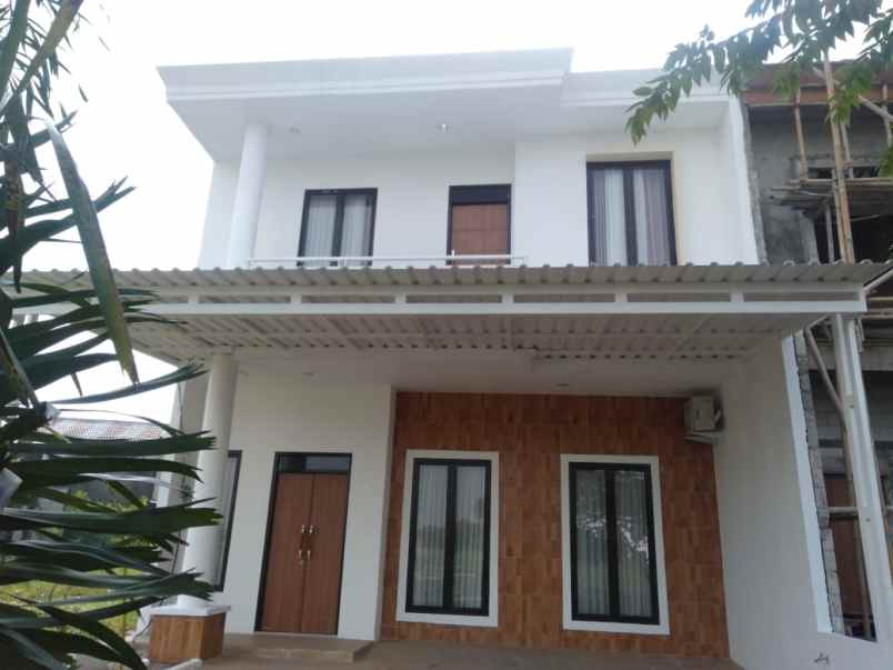 rumah jl raya kota harapan