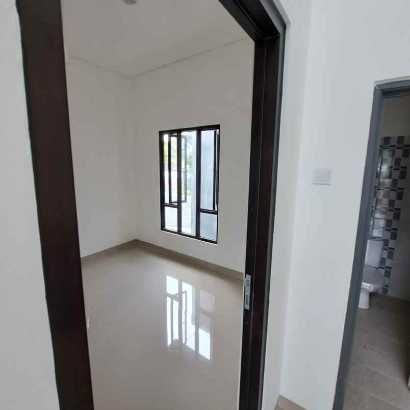 dijual rumah jalan raya parpostel