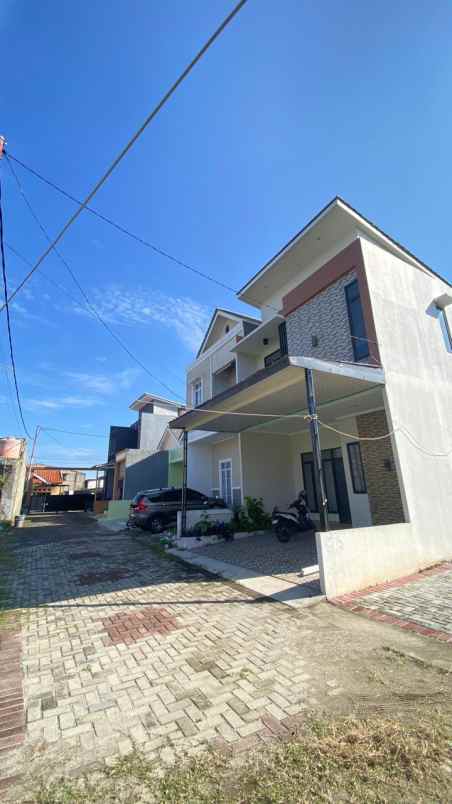 ahzavi rumah 2 lantai dekat gt jatiwarna
