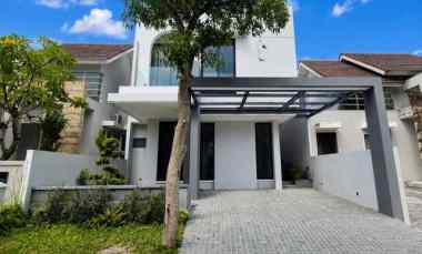 rumah woodland citraland new minimalis carport